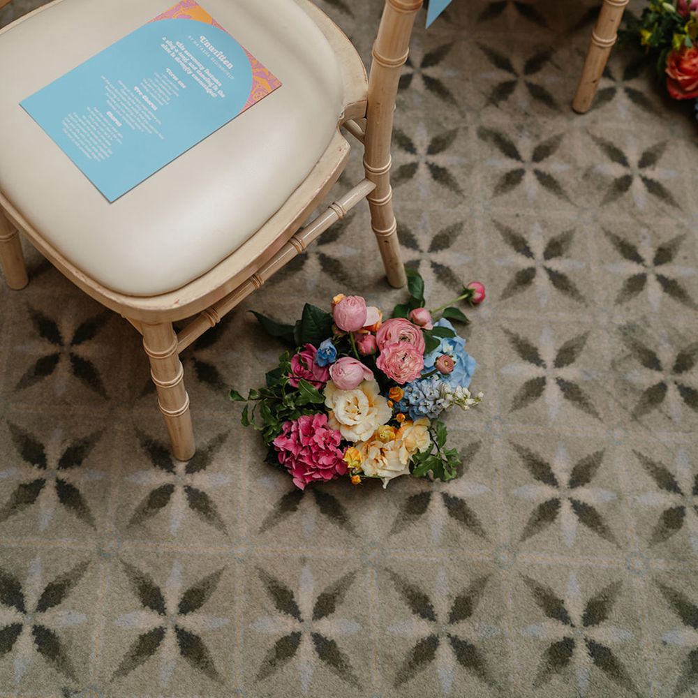 wedding-aisle-flowers-with-blue-stationery