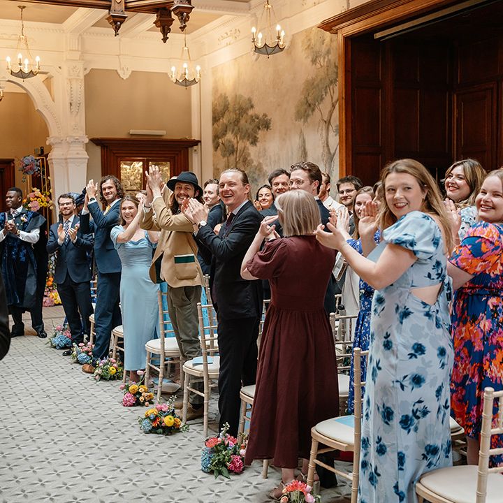wedding-guests-cheer-the-married-couple