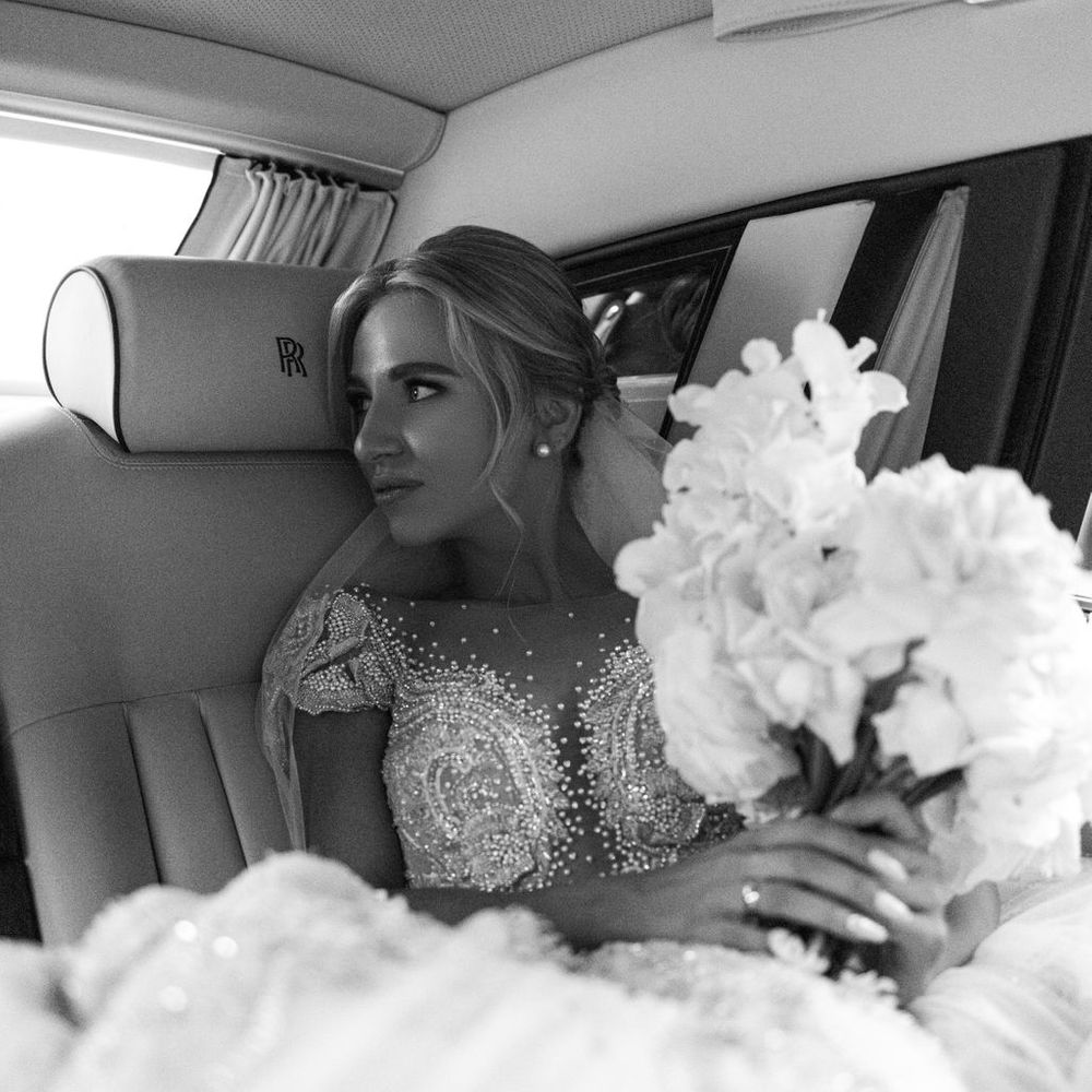 bride-in-beaded-wedding-dressin-the-rolls-royce-wedding-car