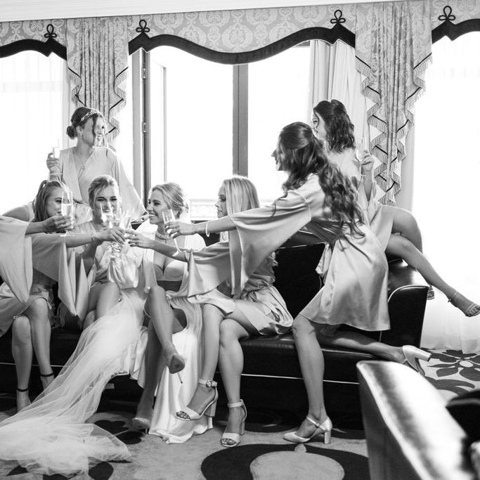 bridesmaids-in-robes-getting-ready-with-bride