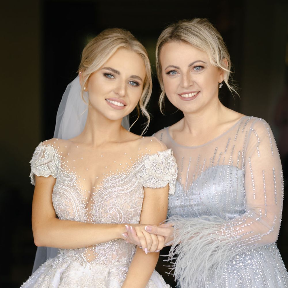 mother-of-the-bride-in-silver-grey-dress-hugging-bride