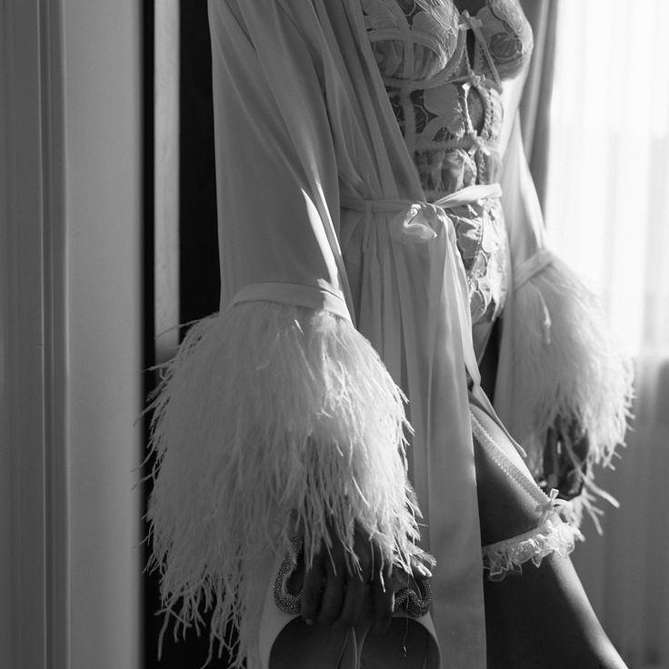 Bride Wearing White Floral Lingerie Bodysuit with Feathered Robe