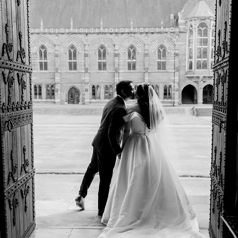black-and-white-kiss-photo-of-bride-and-groom