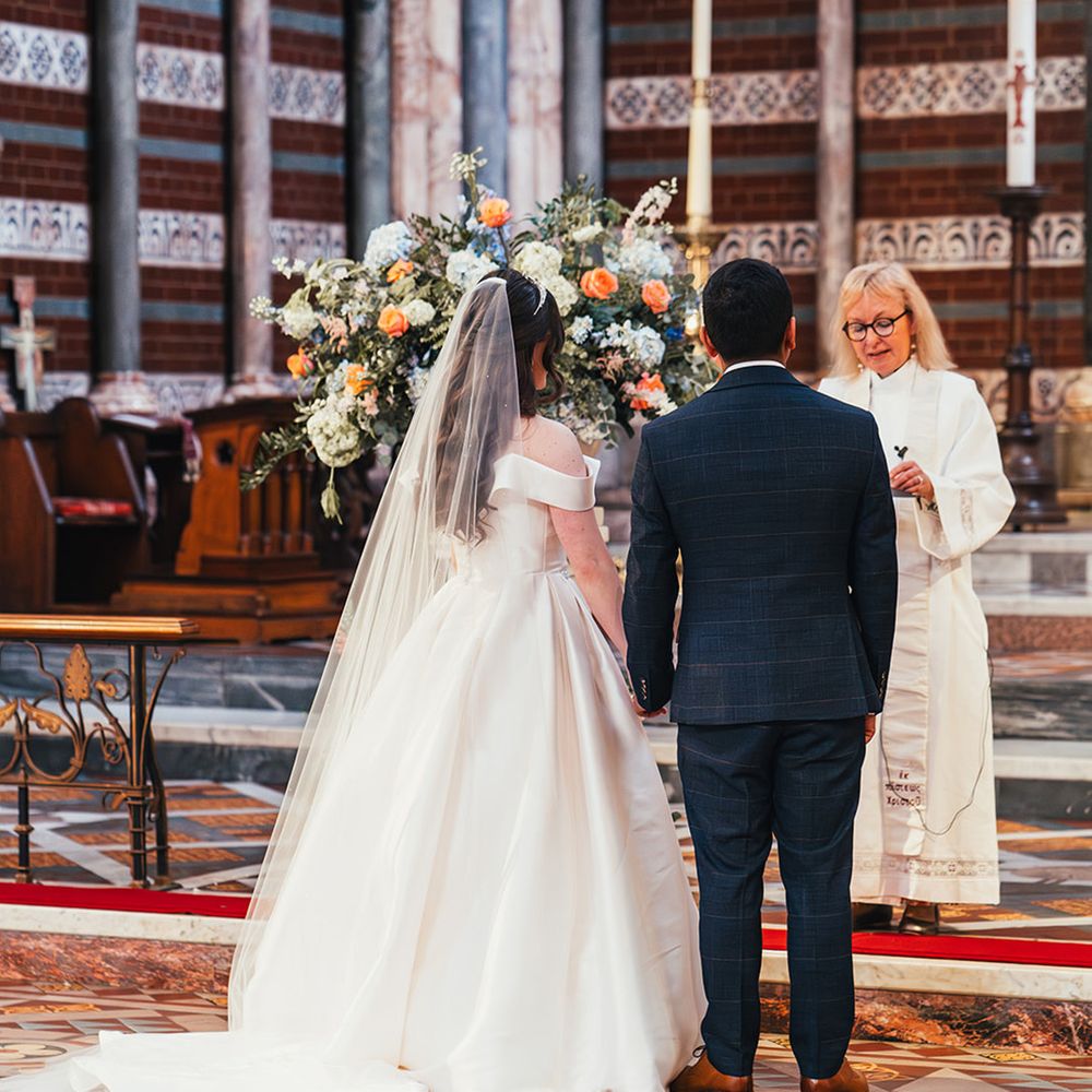 bride-and-groom-standing-for-wedding-ceremony-in-church