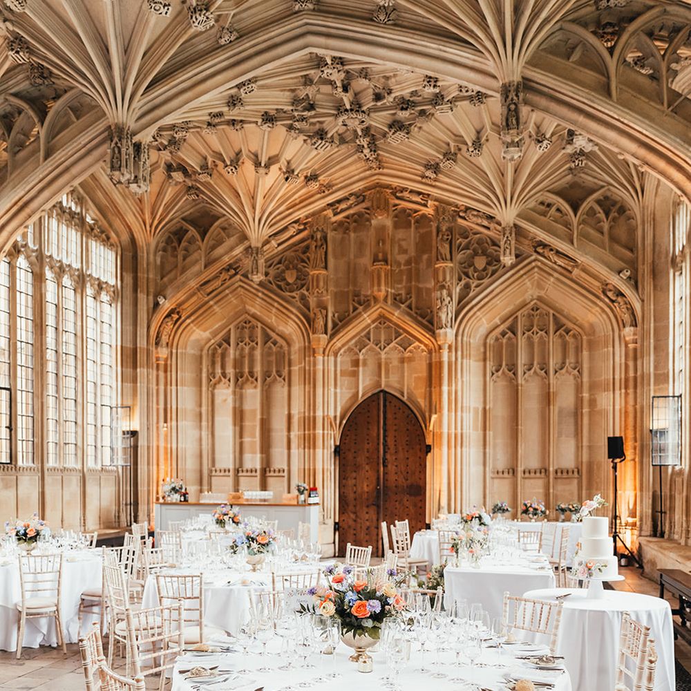 white-round-wedding-tables-with-colourful-flower-centrepiece