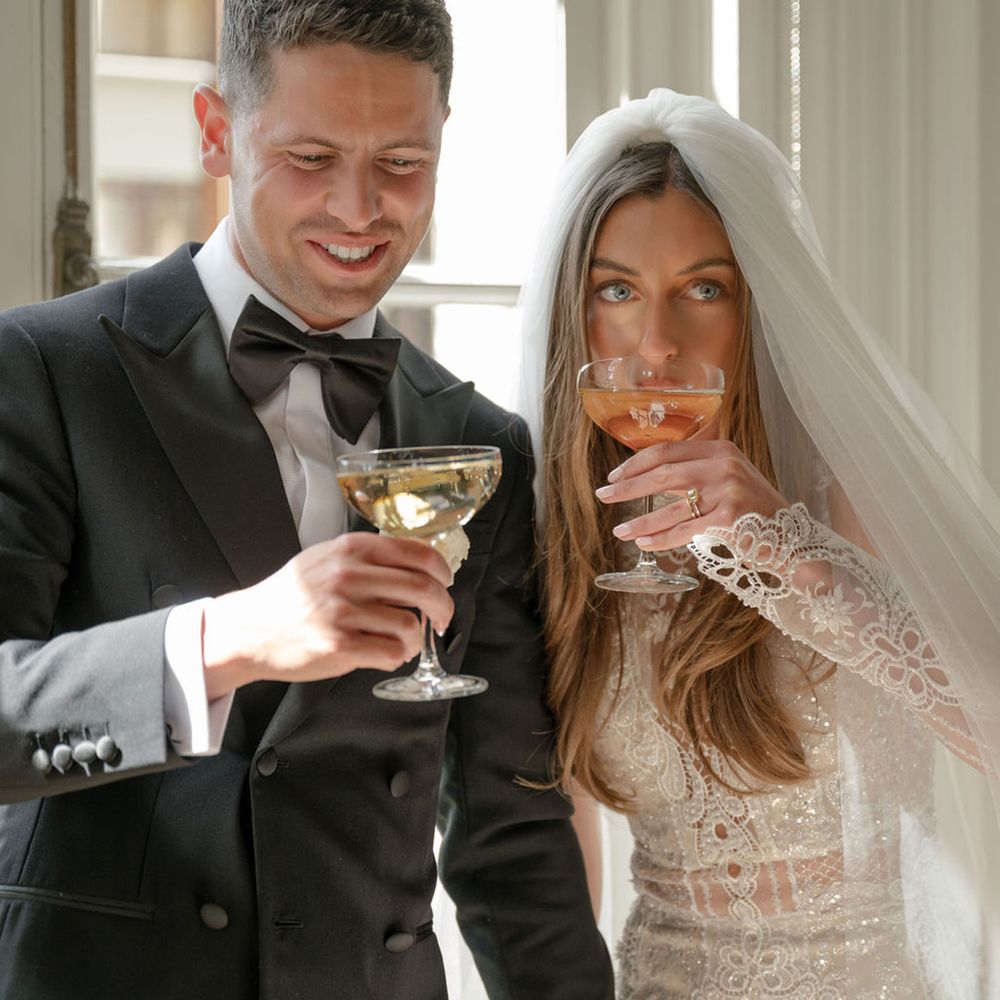 bride-and-groom-drinking-champagne-coupes
