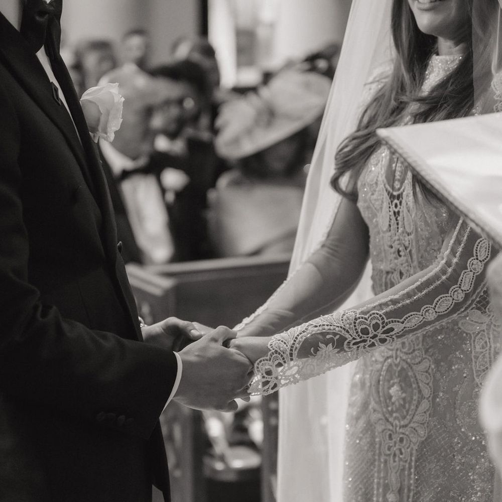 bride-and-groom-hold-hands-for-wedding-day