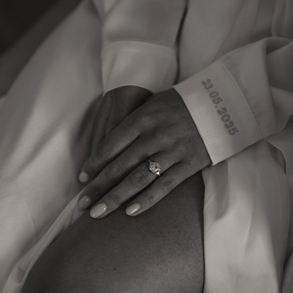 bride-with-personalised-embroidered-robe-with-art-deco-engagement-ring