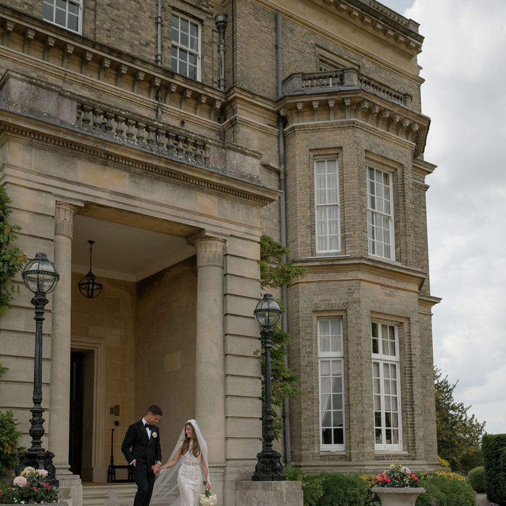 Couple walks around grounds at Hedsor House