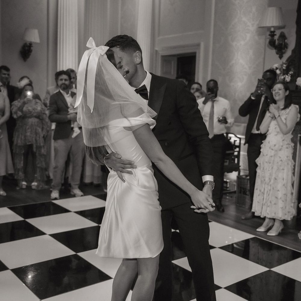 First dance moment on checkered dance floor
