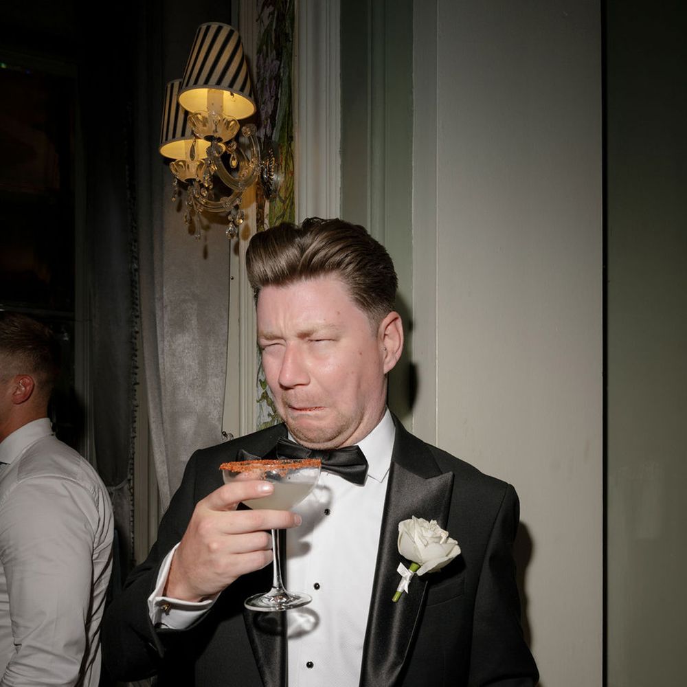 wedding-guest-pulls-face-drinking-spicy-marg-drink.