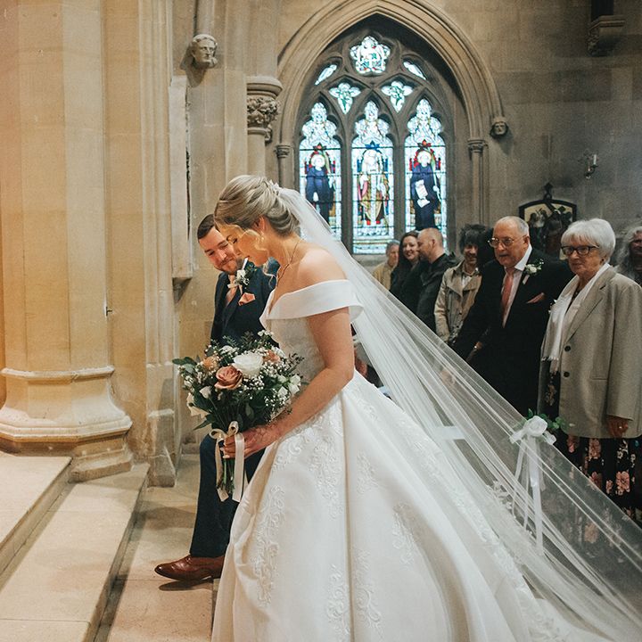 bride-and-groom-walk-to-the-altar-at-church-wedding