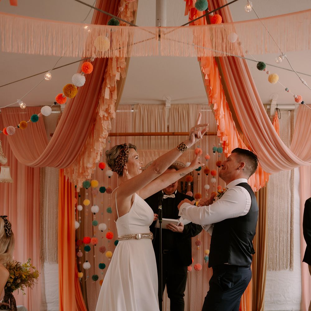 bride-hugs-groom-during-ceremony