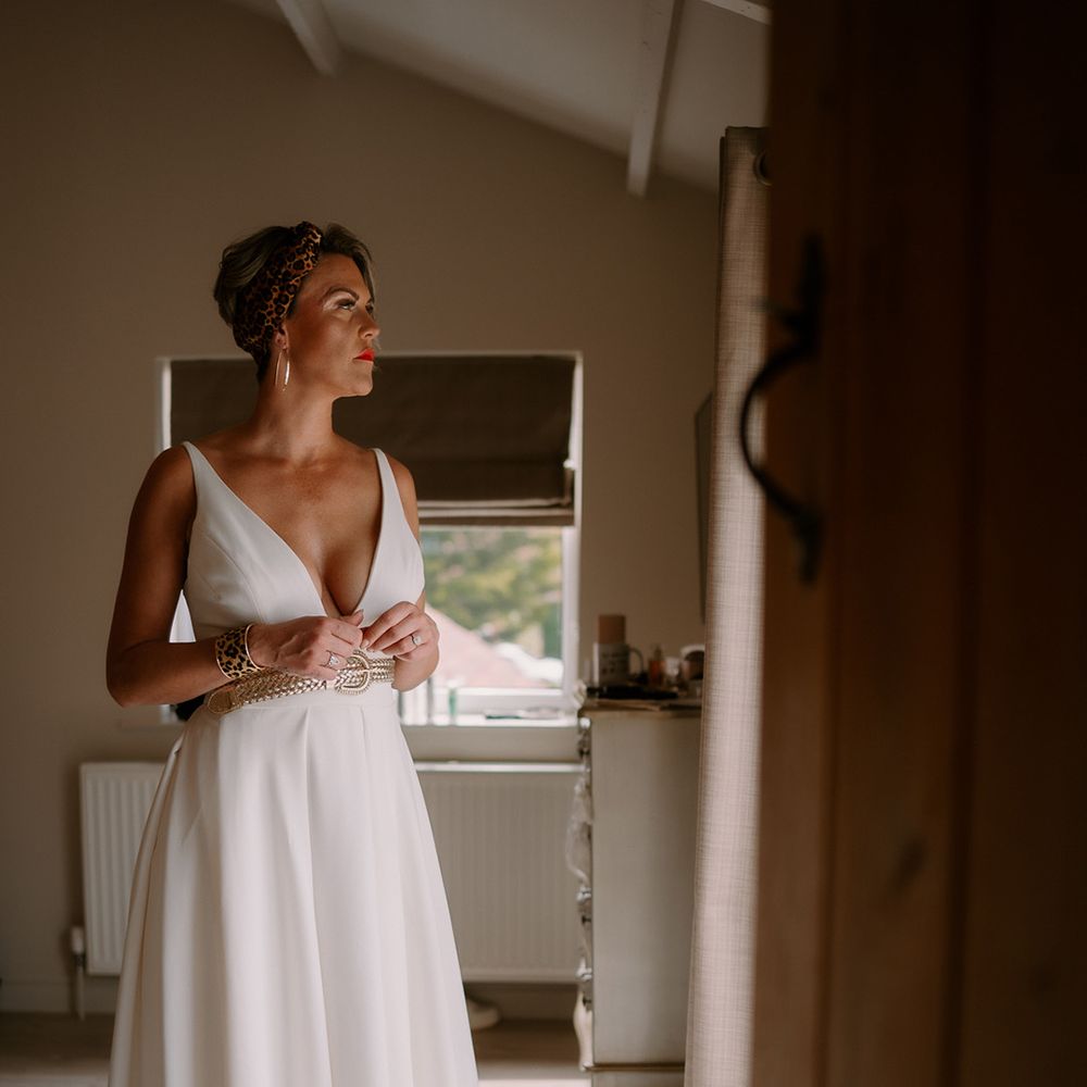 bride-in-plunge-wedding-dress-getting-ready