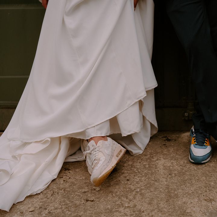 bride-wears-pink-cream-wedding-trainers-and-groom-wears-nike-trainers