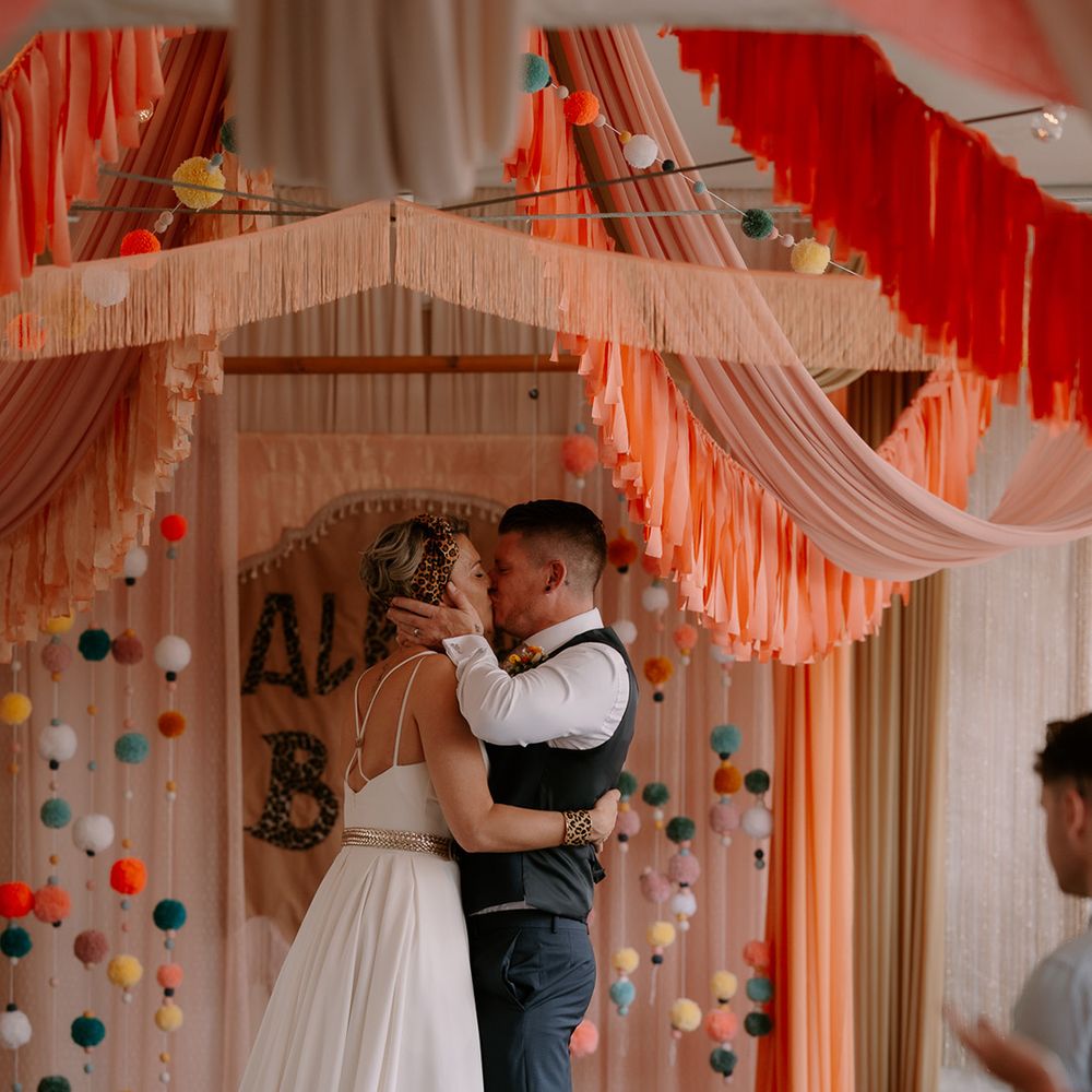 first-kiss-for-bride-and-groom-at-eclectic-wedding