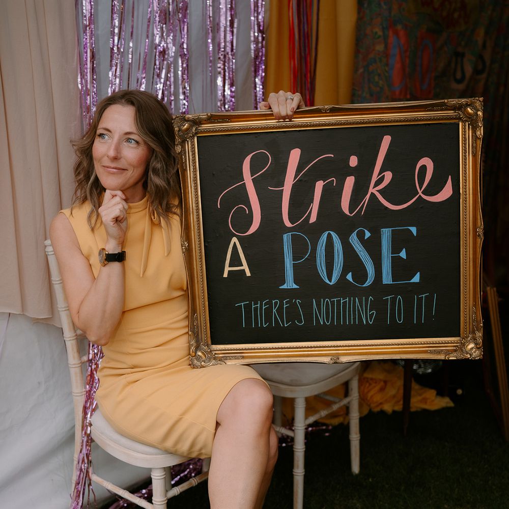 wedding-guest-uses-photo-booth-props