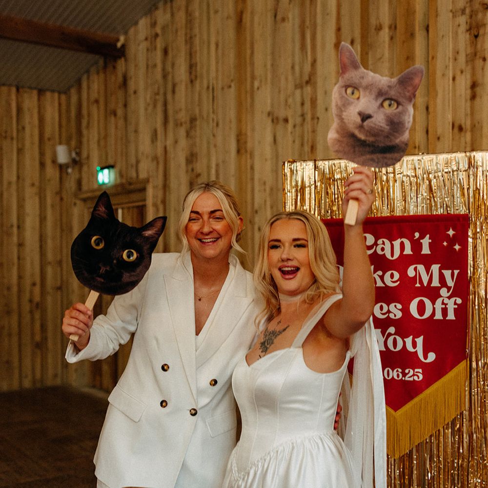 cut-outs-of-cats-held-by-brides