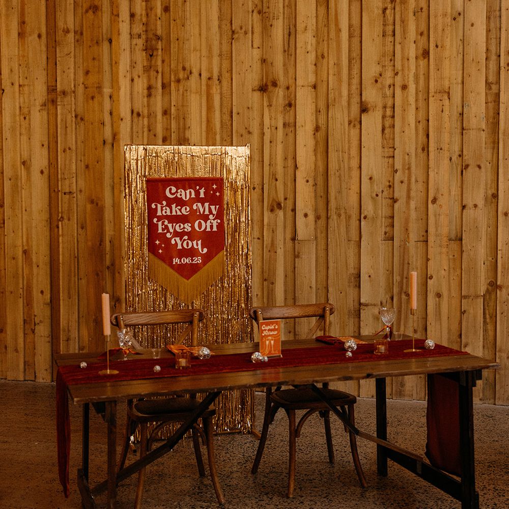 orange-wedding-banner-sign-and-gold-metallic-stramer-backdrop-for-sweetheart-table