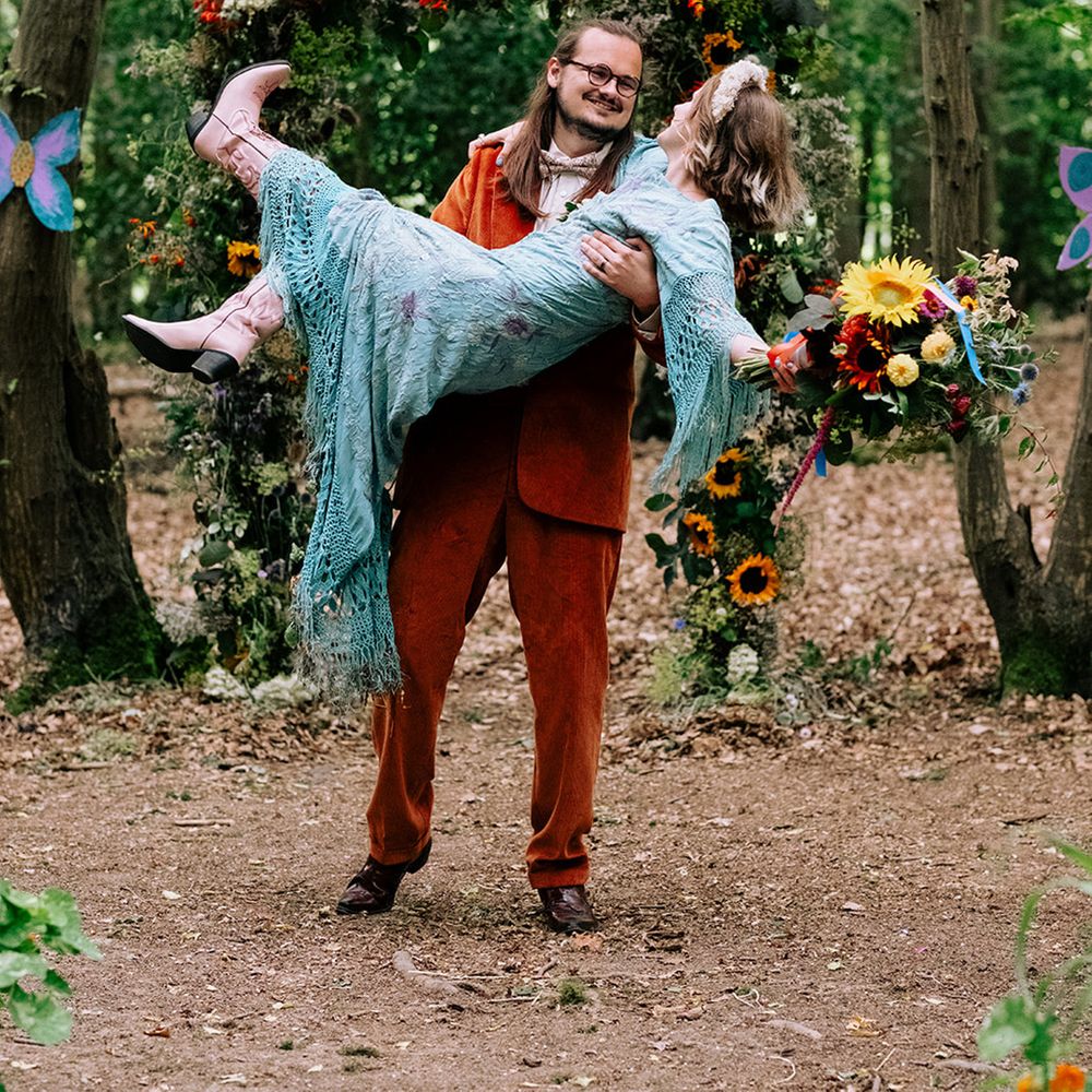 groom-lifts-bride-in-fun-wedding-photo