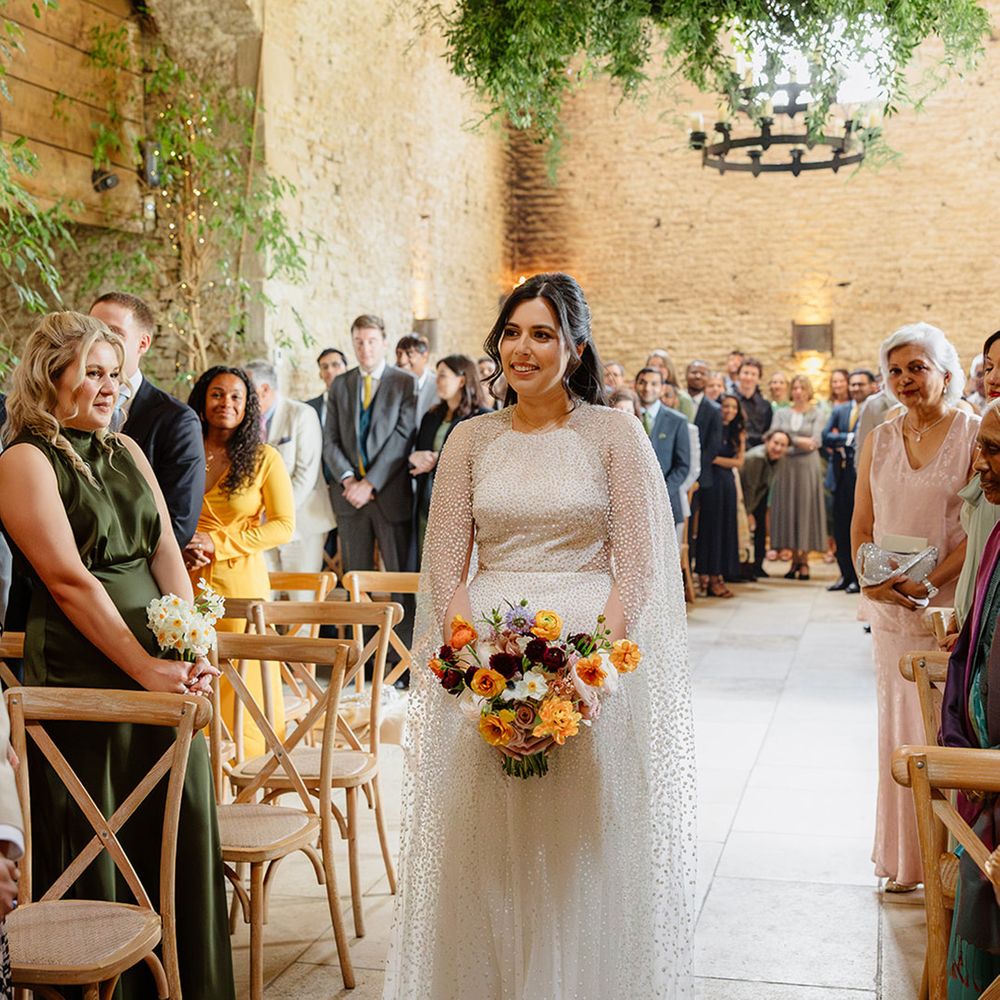 bride-in-jesus-piero-wedding-dress-with-cape