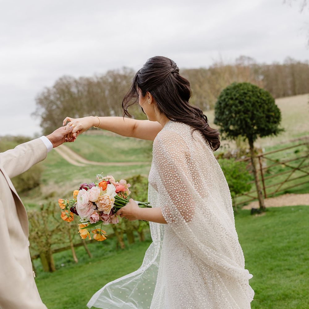 bride-wearing-jesus-piero-bridal-cape-and-wedding-dress