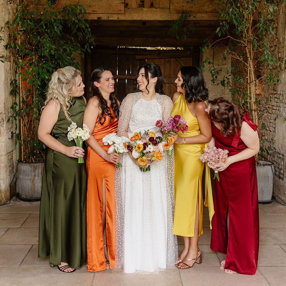 bridesmaids-laughing-in-mismatched-autumnal-bridesmaid-dresses