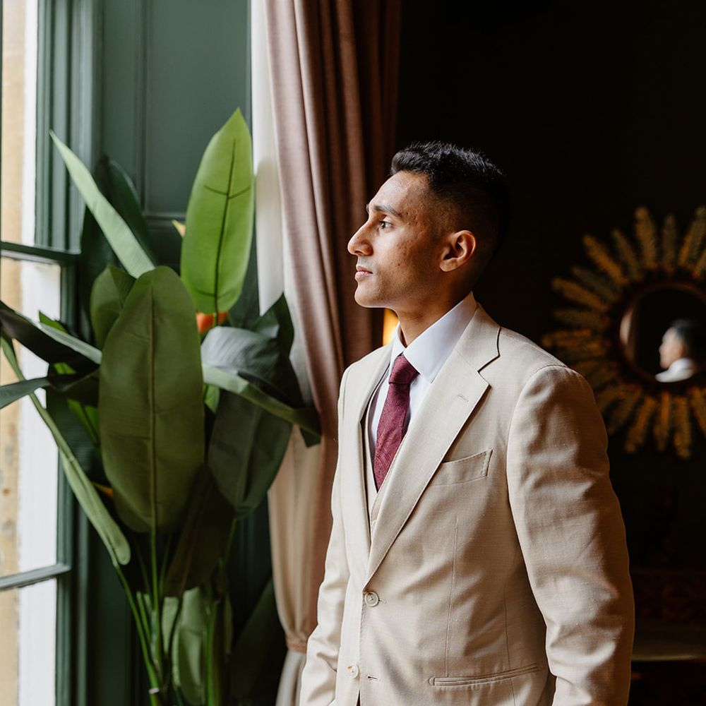 groom-in-cream-wedding-suit