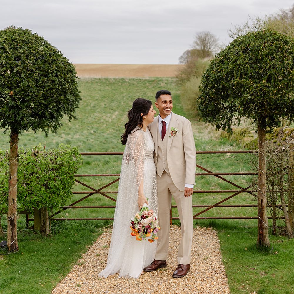 rustic-barn-wedding-venue-with-bride-and-groom-posing-for-couple-portraits