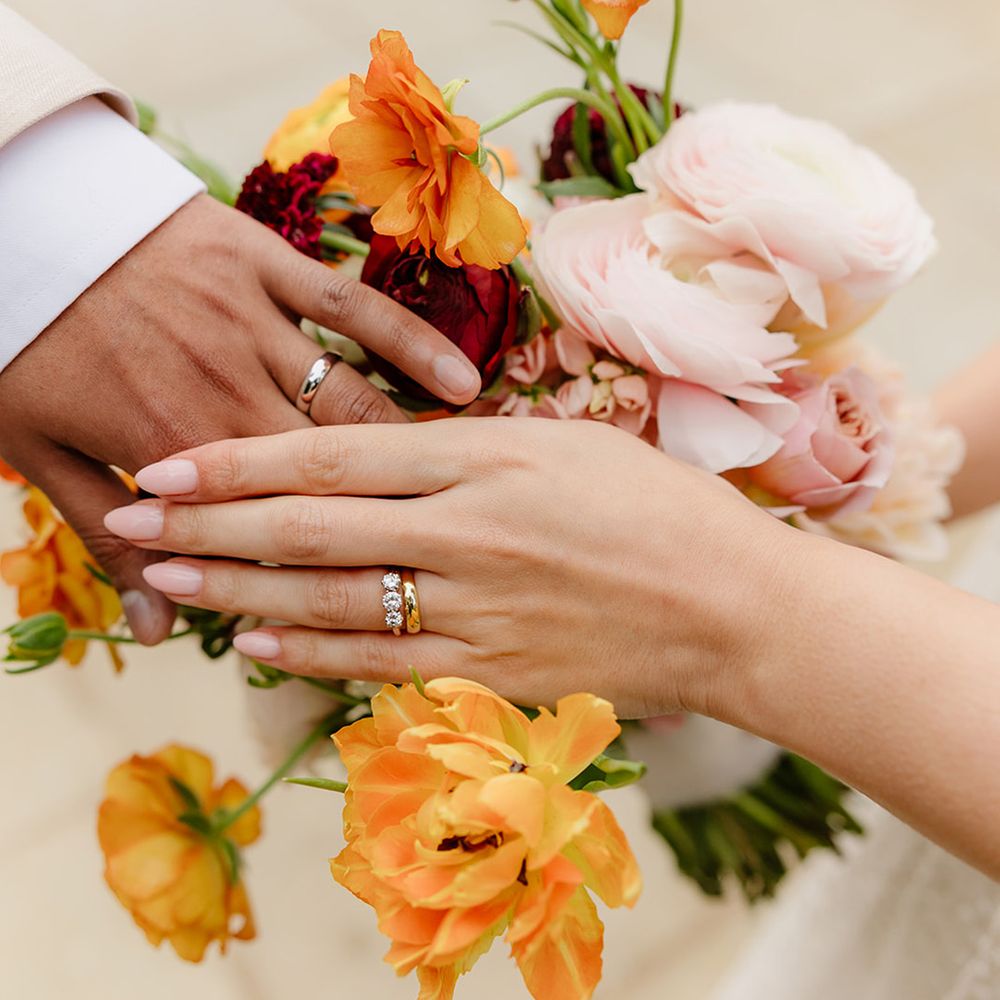 trinity-stone-engagement-ring-and-gold-wedding-bands