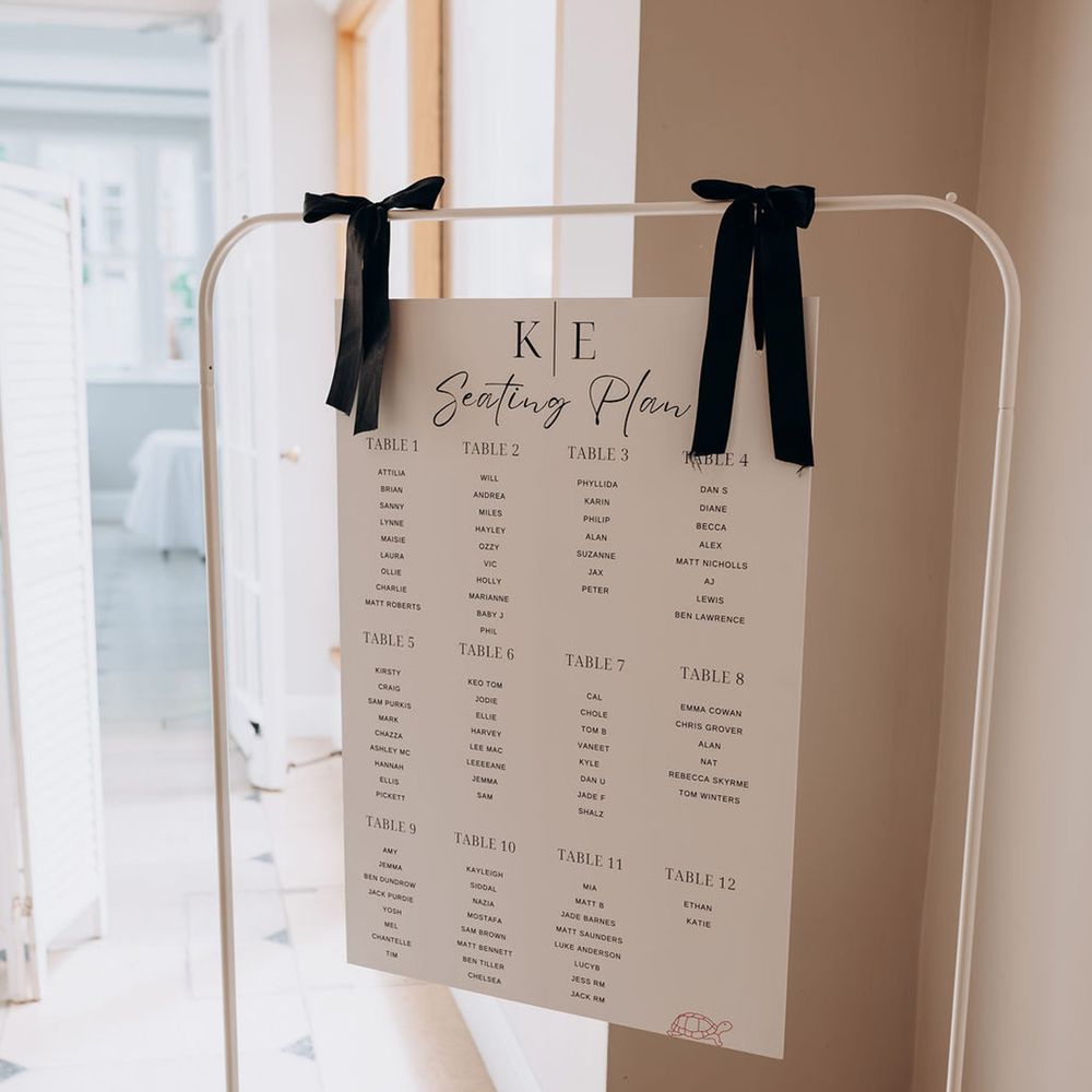 black-bow-wedding-seating-chart-signage