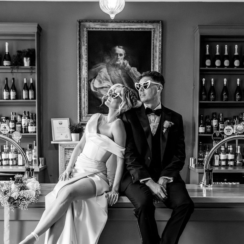 bride-and-groom-sit-on-the-bar.