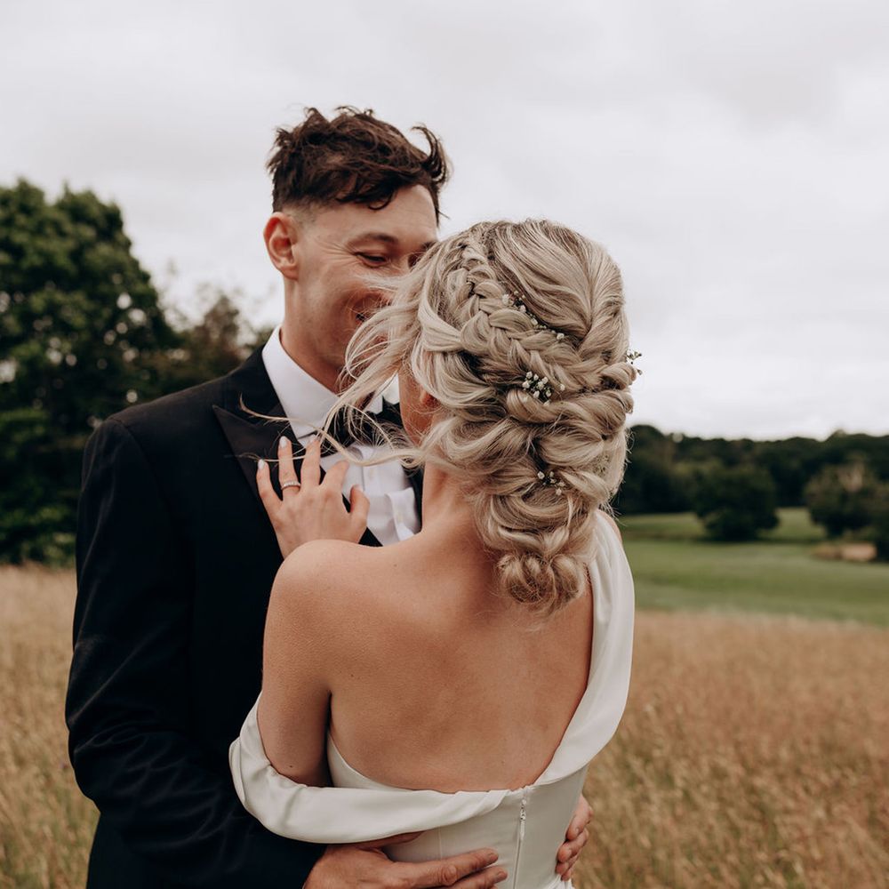 bride-wearing-blonde-hair-in-intricate-braided-updo-hiarstyle