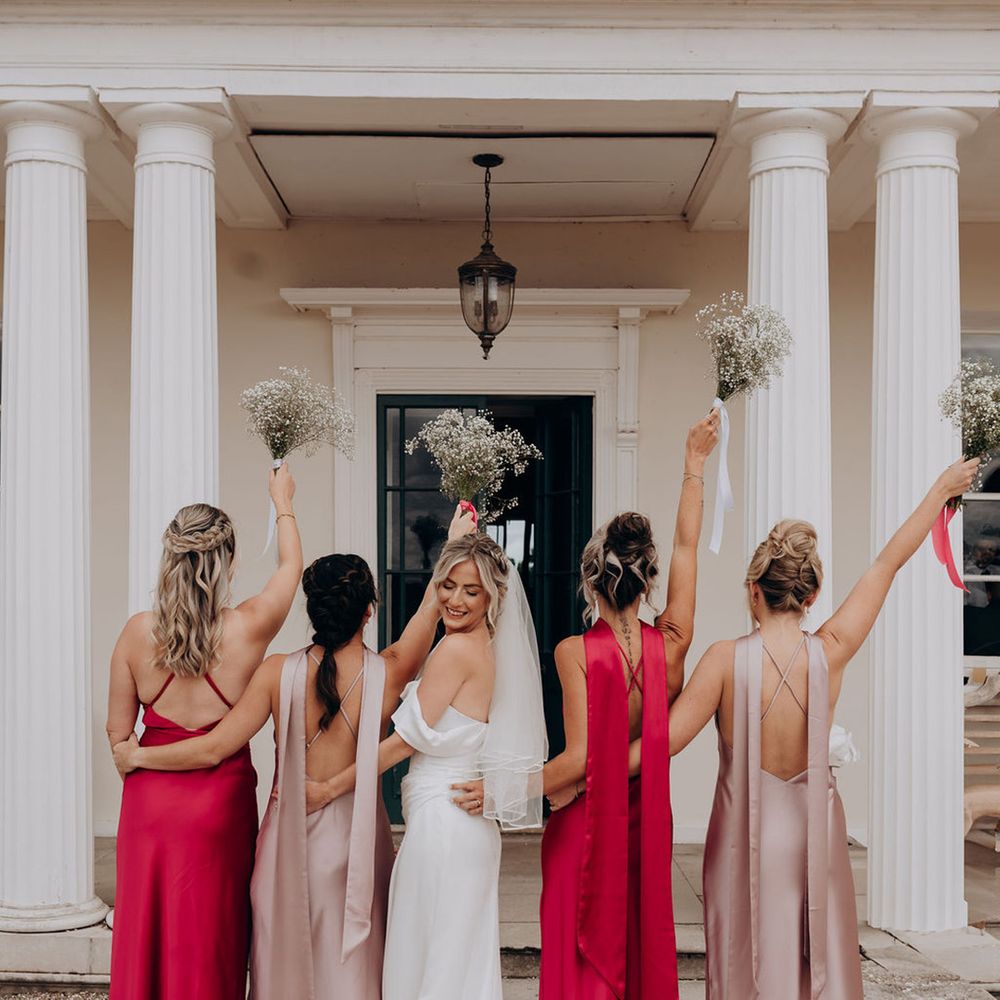 bridesmaids-holding-gypsophila-bouquets-in-the-air.
