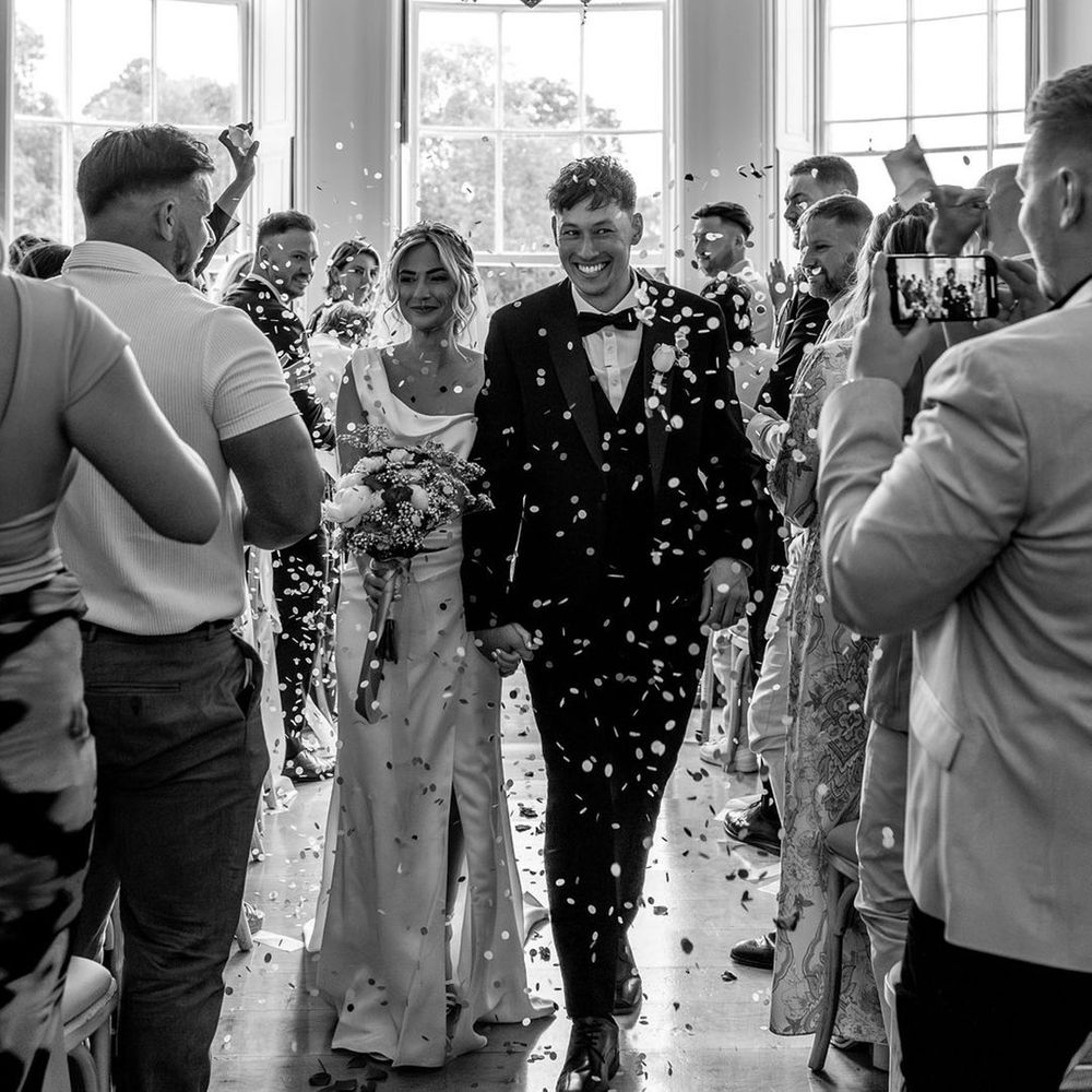 guests-throw-confetti-over-newlyweds