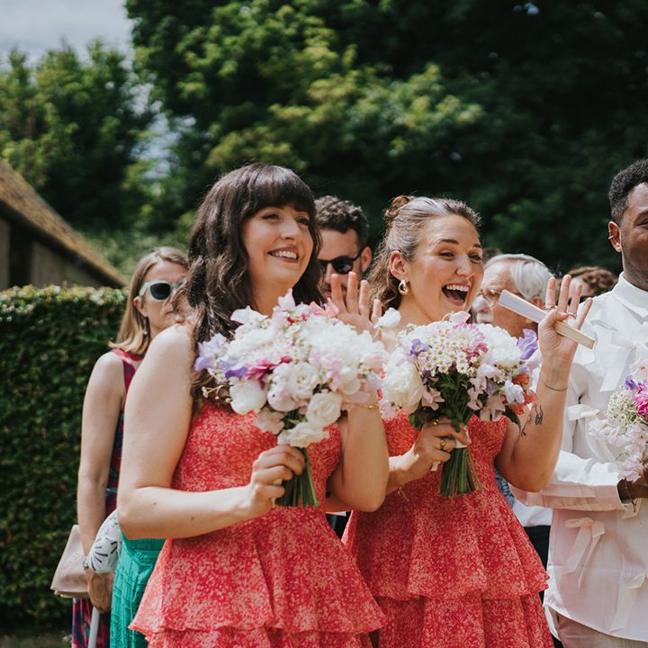 bridal-party-with-red-ruffle-bridesmaid-dresses-and-bridesman-in-bow-shirt