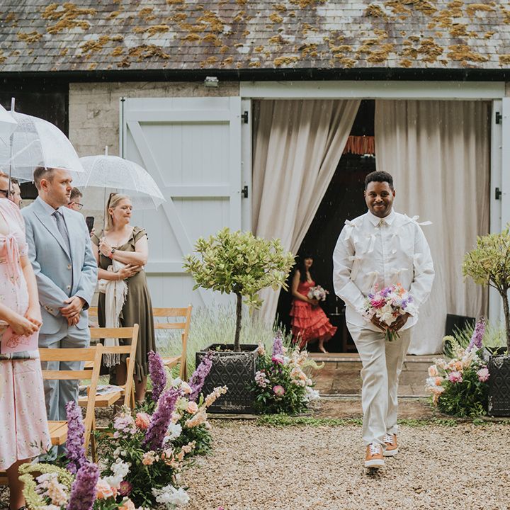 bridesman-walks-down-the-aisle-in-bow-shirt