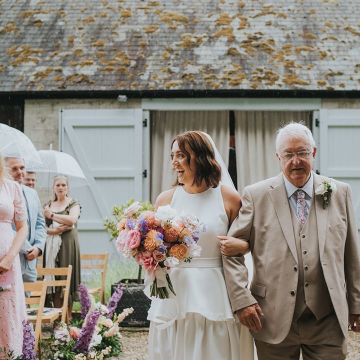 father-of-the-bride-and-bride-walk-down-the-aisle-together