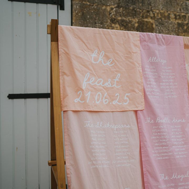 orange-yellow-and-pink-fabric-wedding-signage