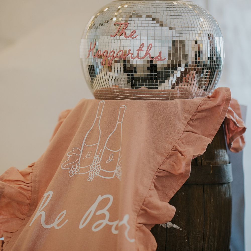 pink-fabric-sign-with-disco-ball