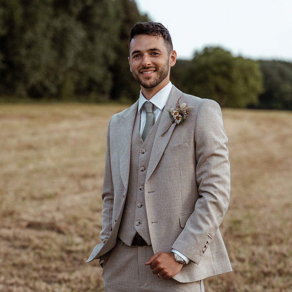 groom-in-three-piece-grey-wedding-suit