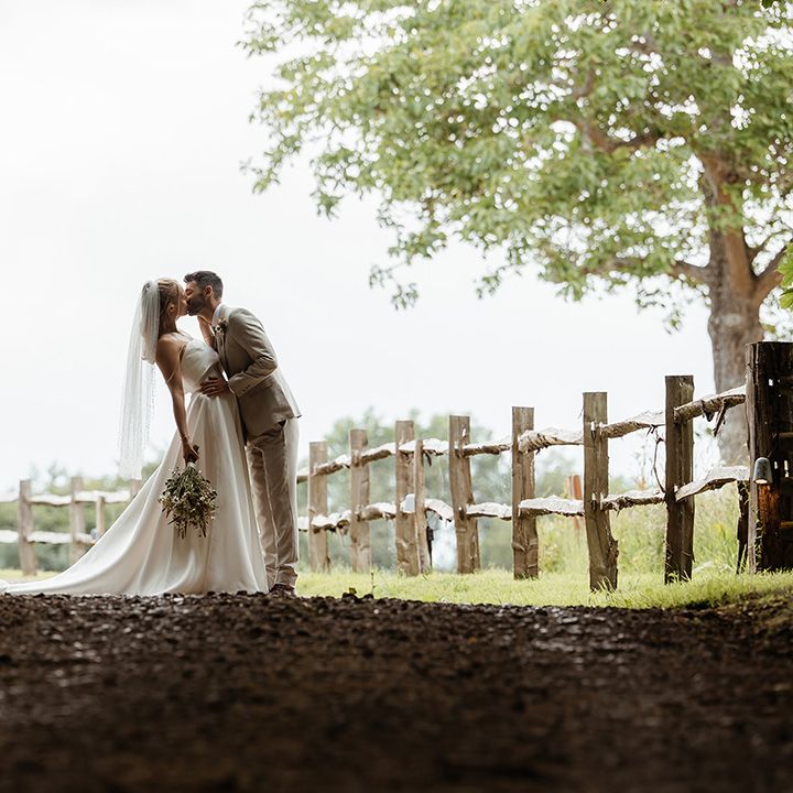 groom-leans-into-kiss-bride