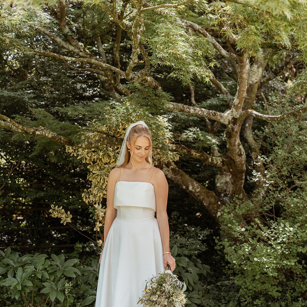 strapless-wedding-dress-with-bride-wearing-blonde-hair-in-half-up-half-down-style