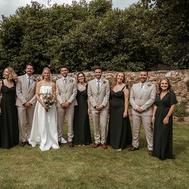 wedding-party-group-photo-with-grey-suits-and-dark-green-bridesmaid-dresses