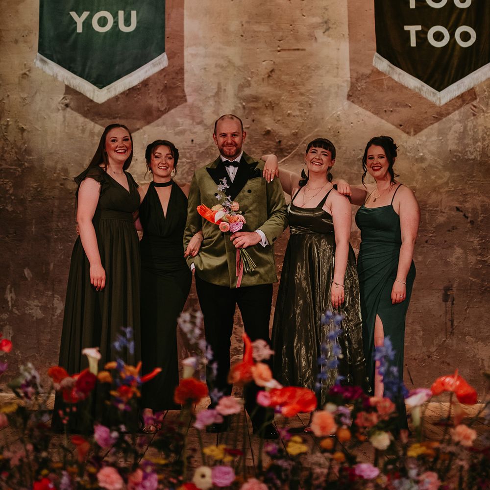 best-women-in-dark-green-wedding-outfits-with-groom-in-dark-green-suit