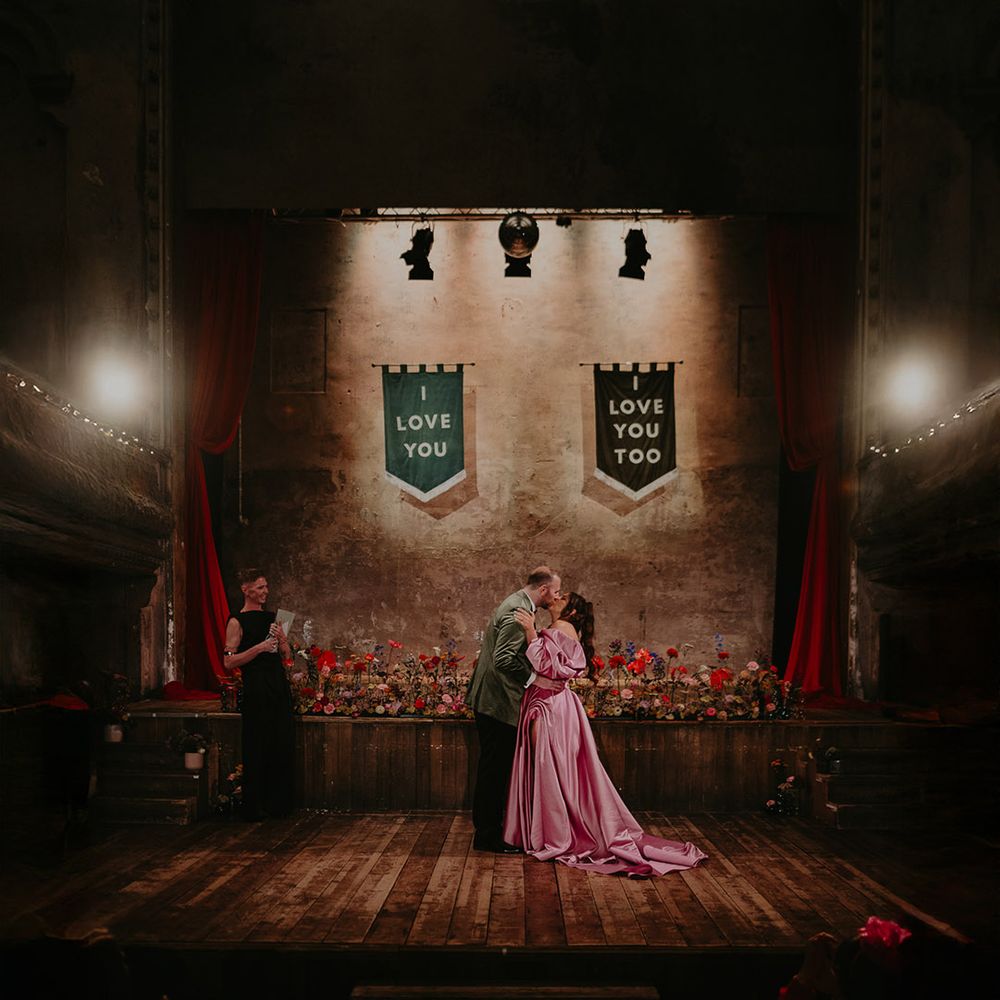 first-kiss-for-couple-with-custom-banner-signage