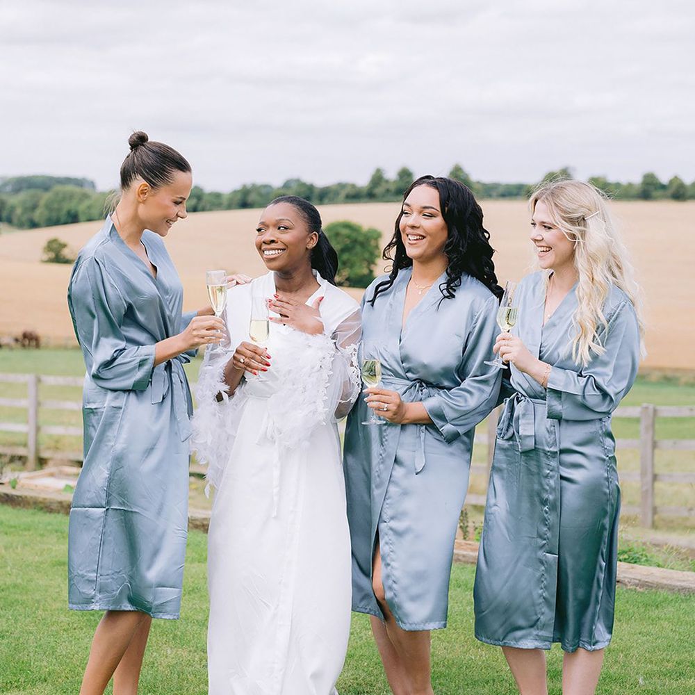 Bridal party outdoors wearing robes in nature for wellness hen