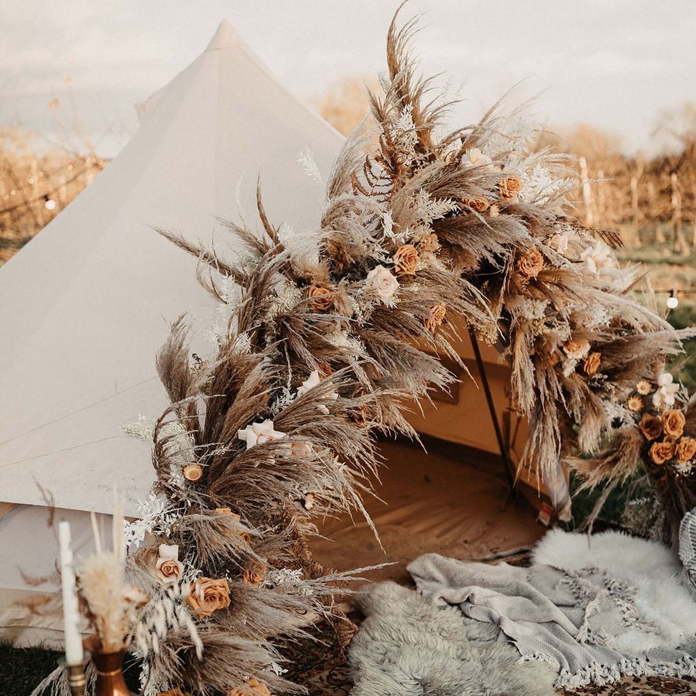 Bell tent with decorative dried flowers for wellness hen do