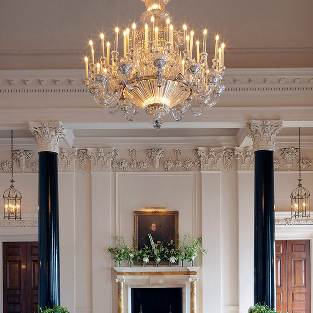 Chandelier hands above saloon room wedding breakfast