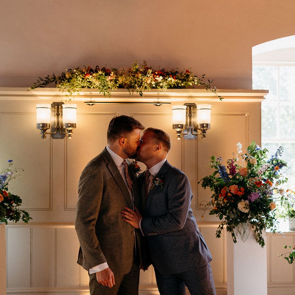 First kiss for grooms at wedding ceremony in Tower of London